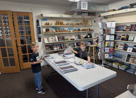 Cousins William O’Dell (left) and George Boyle (right) insert ads into the San Juan Record on a busy Wednesday morning. Bill Boyle photo