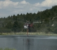 A type 1 helicopter pulling water to help cool hotspots in areas that crews are working on Friday. Courtesy photo