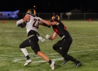 Monticello teammates Arturo Gutierrez (23) and Miles Coleman (24) battle at the Orange/Black scrimmage. Anna Fredericks photo