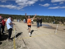 Monticello Senior Kooper Nielson crosses the finish line in 1st place 