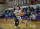 Jake Deswood drives to the basket against Pinnacle. The Cougars earned a close 58-56 win at home. Lee Ke photo