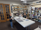 Cousins William O’Dell (left) and George Boyle (right) insert ads into the San Juan Record on a busy Wednesday morning. Bill Boyle photo