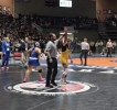 Khatira Keith has her hand raised after winning the state championship. 